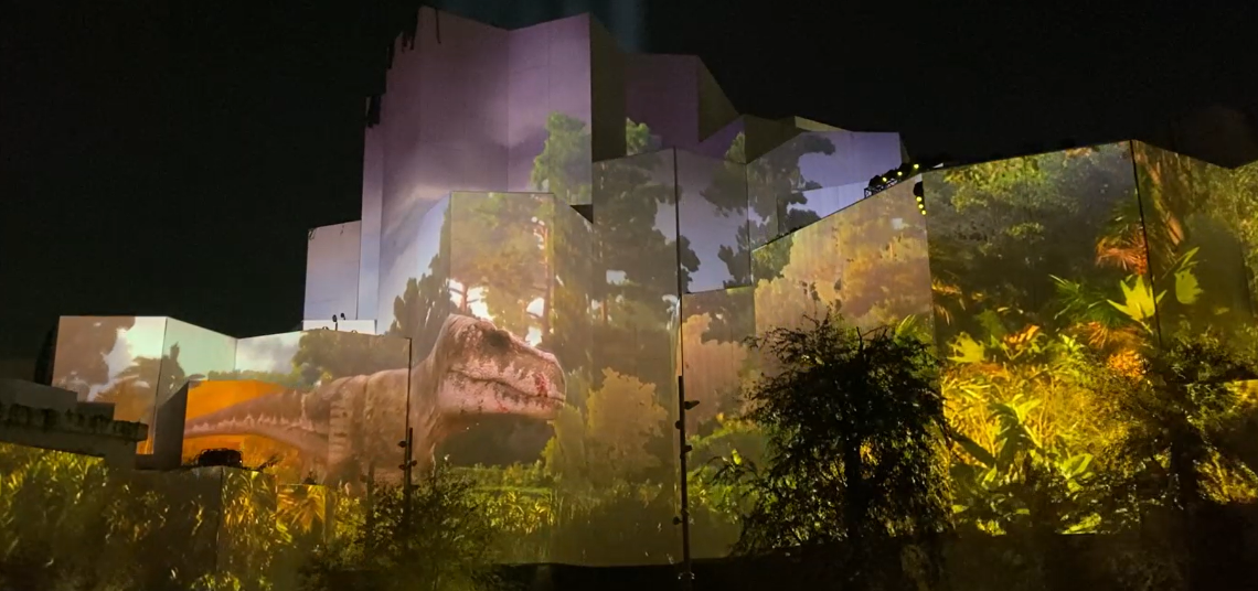 The Ultra High Performance Concrete cladding transforms into a screen during the opening ceremony